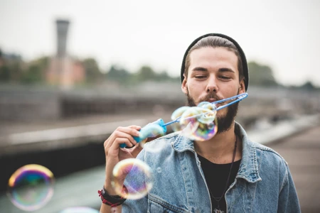 Young man with bubble maker